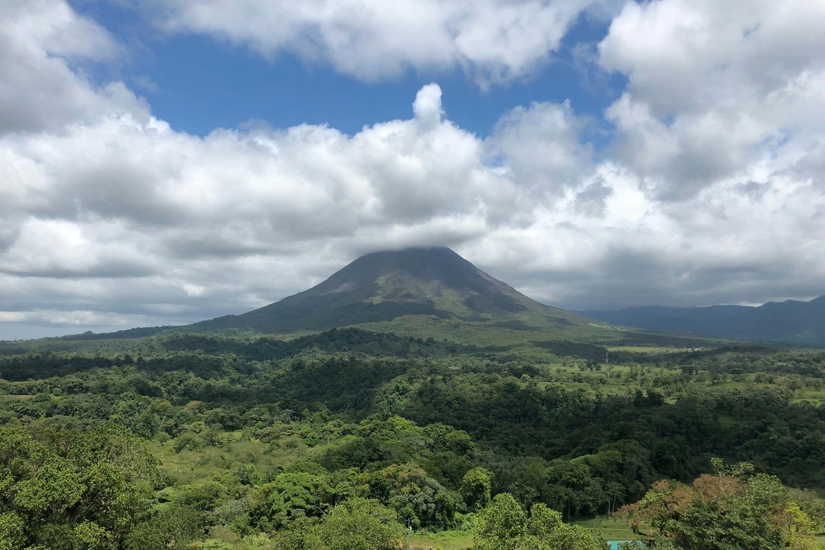 Arenal Volcano rising above rainforest in Costa Rica